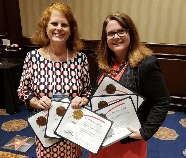 Amy Mathis and Kelley Roark accept NCMPR Awards